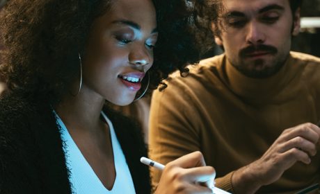 Two people looking at a tablet