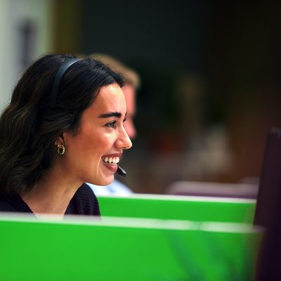 Woman smiling at desk