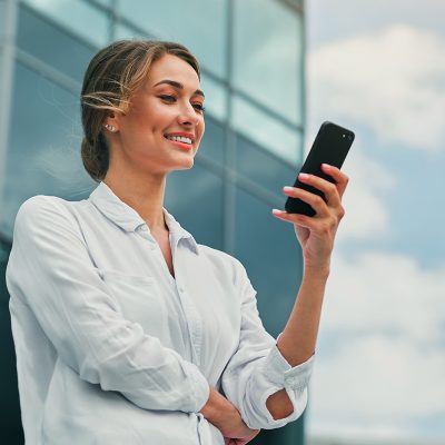 Woman smiling at cellphone